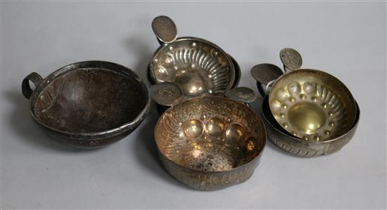 Three French silver wine tasters, two plated wine tasters and an early 19th century French? coconut cup.